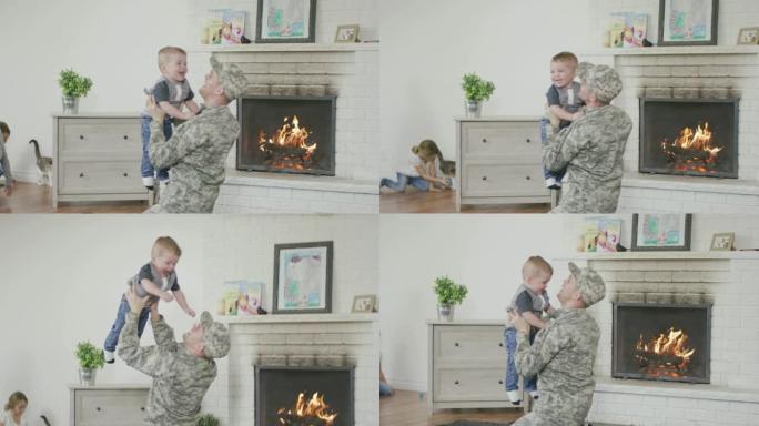 士兵父亲和他的小男孩玩