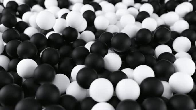 黑白4k 3D动画从一堆抽象的球体和球从上到下滚动和下降。