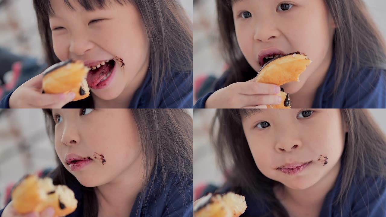 可爱的女婴凌乱的婴儿在家吃面包巧克力，人，生活方式，孩子，家庭，用餐，幸福。视频: 多样化的肖像