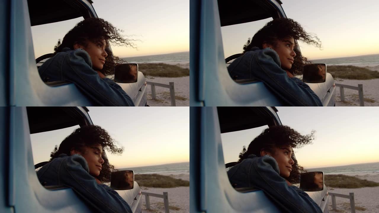 女子靠在4k海滩皮卡车的窗户上