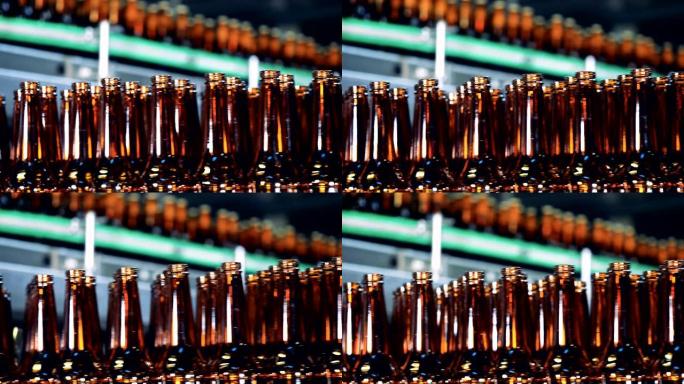 玻璃瓶在啤酒厂的线上移动，关闭。
