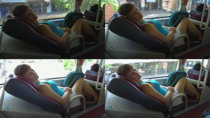 特写: 在越南长途旅行中的女人睡在舒适的公共汽车上。