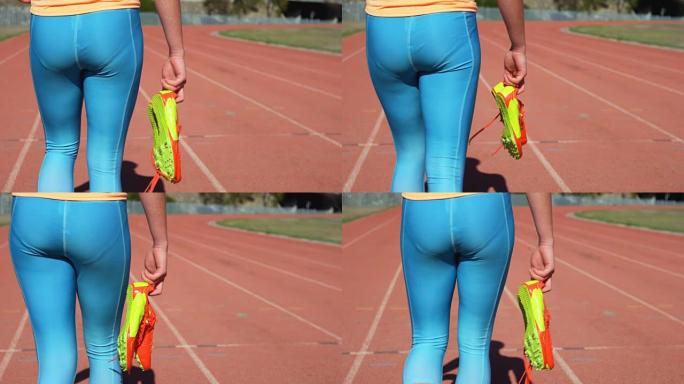 女运动员在4k跑道上穿着运动鞋行走