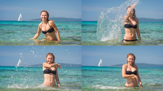 暑假快乐的女人将海水溅向相机