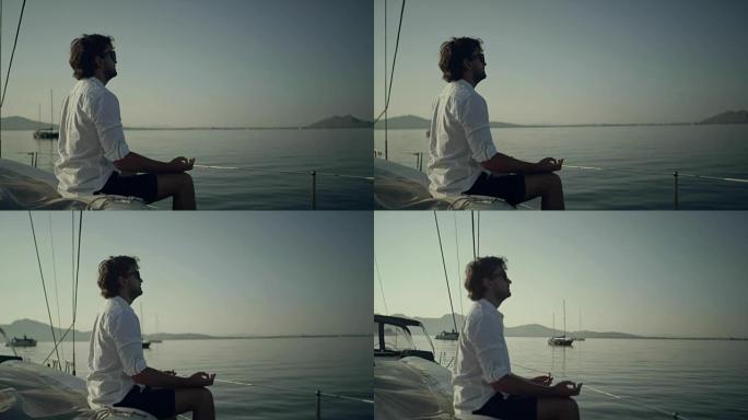 男子在游艇上冥想男子在游艇上冥想户外大海