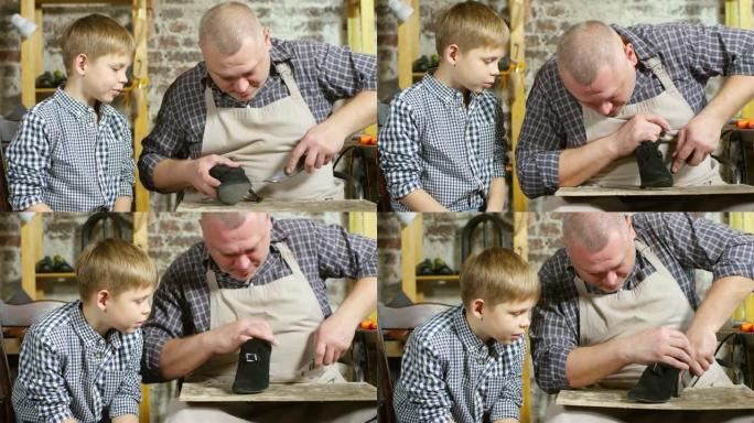 鞋匠在小儿子的帮助下更换脚跟尖端