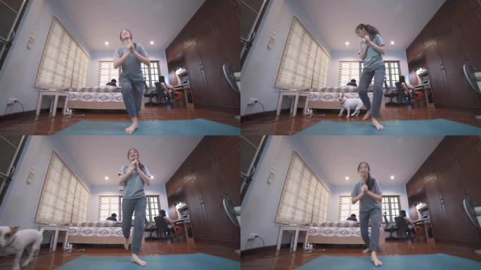 宽镜头亚洲妇女在家里做有氧运动HIIT舞蹈锻炼减肥和身体调理
