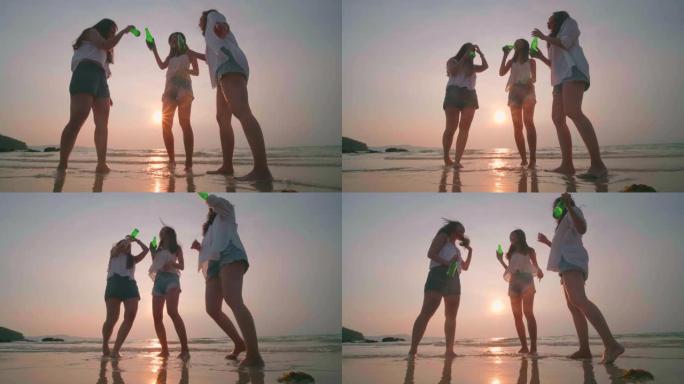 一群年轻女子在日落时在海滩上跳舞