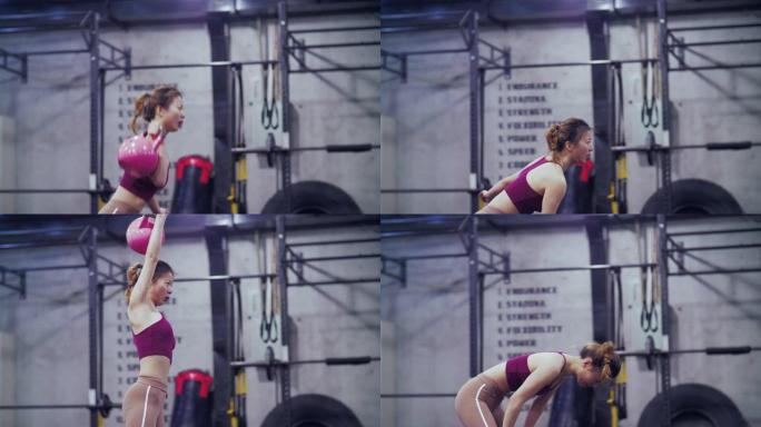 年轻漂亮的亚洲女孩在健身房锻炼的侧视图