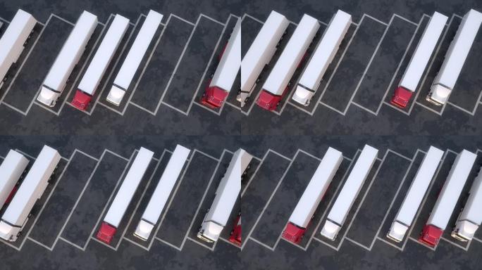 半挂卡车在停车场上排成一排的俯视图。无缝回路