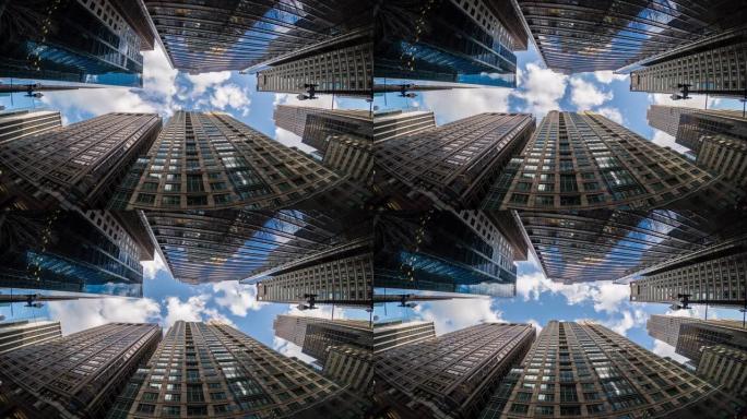 在鱼眼角，美国伊利诺伊州，芝加哥市中心摩天大楼的上升角度与高楼之间的云反射，商业和透视概念