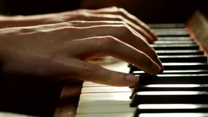 音乐家弹钢琴，在前面读乐谱。音乐家或作曲家用长手指压碎琴键。