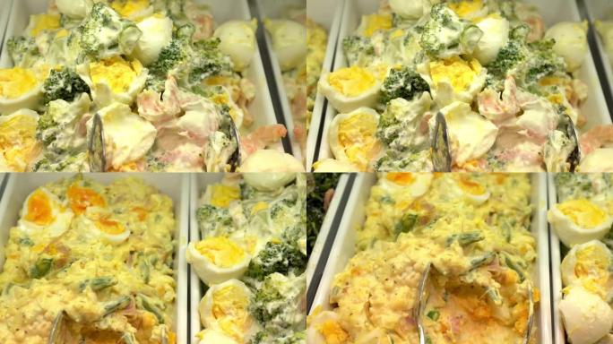 自助餐中的鸡蛋沙拉的平移镜头