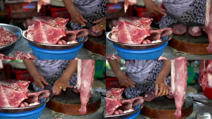 越南芹苴省传统蔡朗新鲜食品市场销售猪肉的女性商人的4k镜头