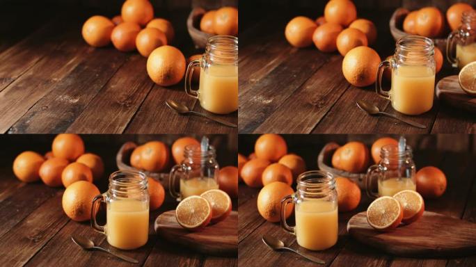 橙汁玻璃罐在乡村木桌上拍摄