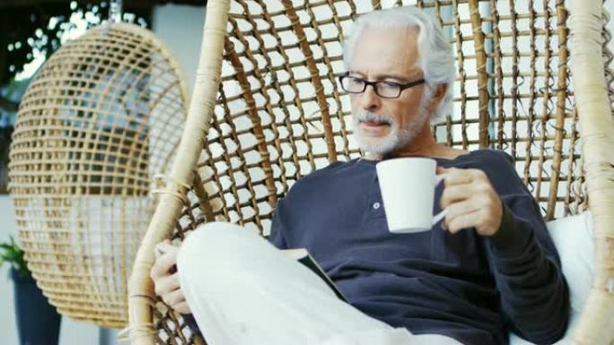 老人一边喝咖啡一边看书4k