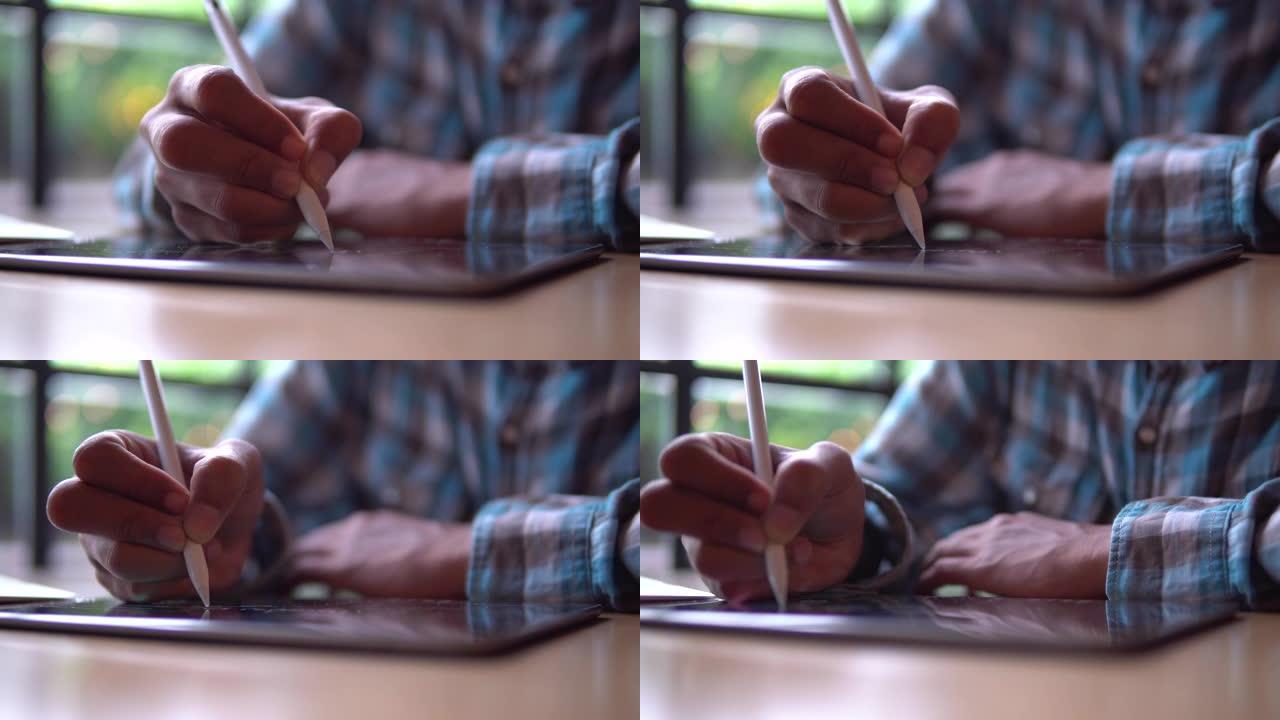 商人在平板电脑上使用数字笔书写