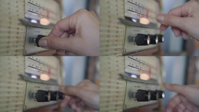 使用模拟老式收音机的手的特写