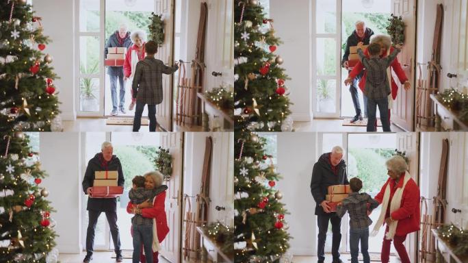 激动的孙子在圣诞节那天向祖父母致以礼物
