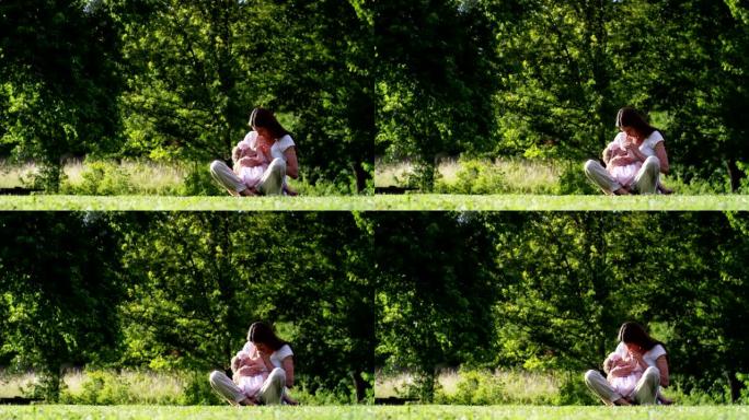 在一个美丽而快乐的阳光明媚的日子里，一个母亲和婴儿小女孩玩耍，快乐地沉浸在五彩缤纷的大自然和幸福中，
