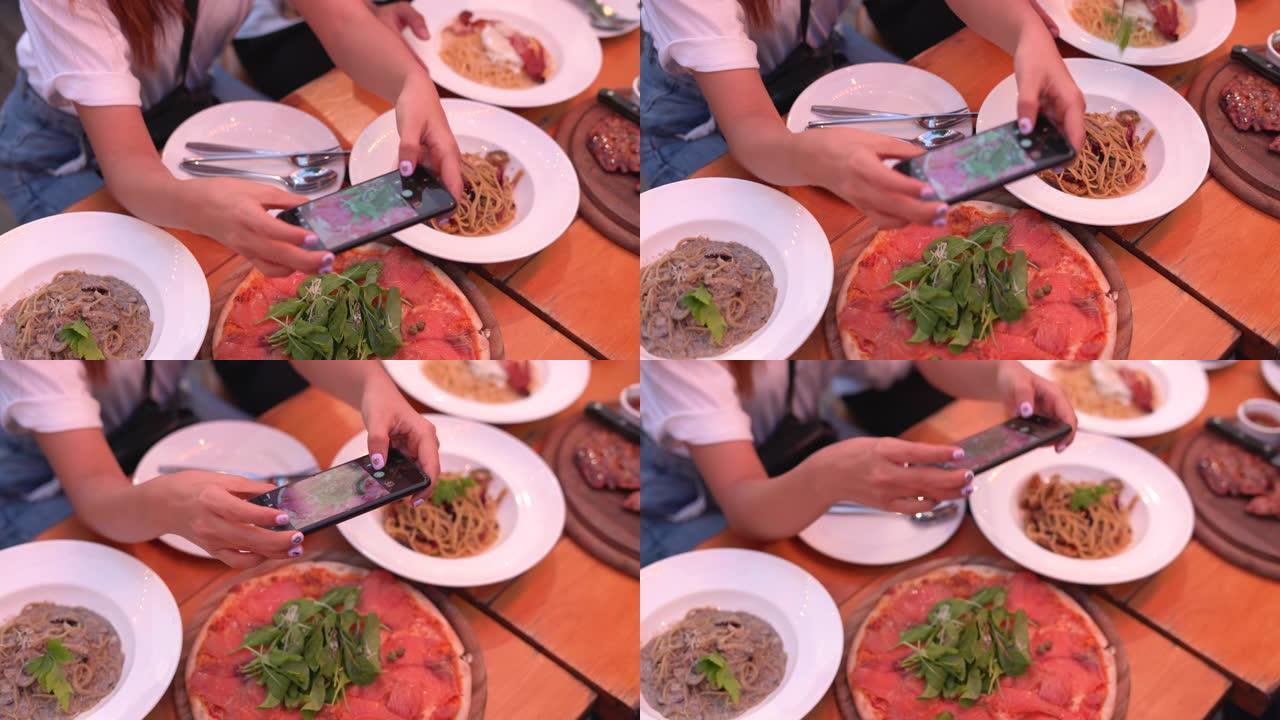 女人用手机给食物拍照