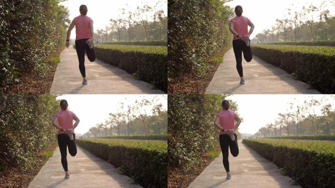 女子跑步者在早上跑步前伸展运动，多莉射击