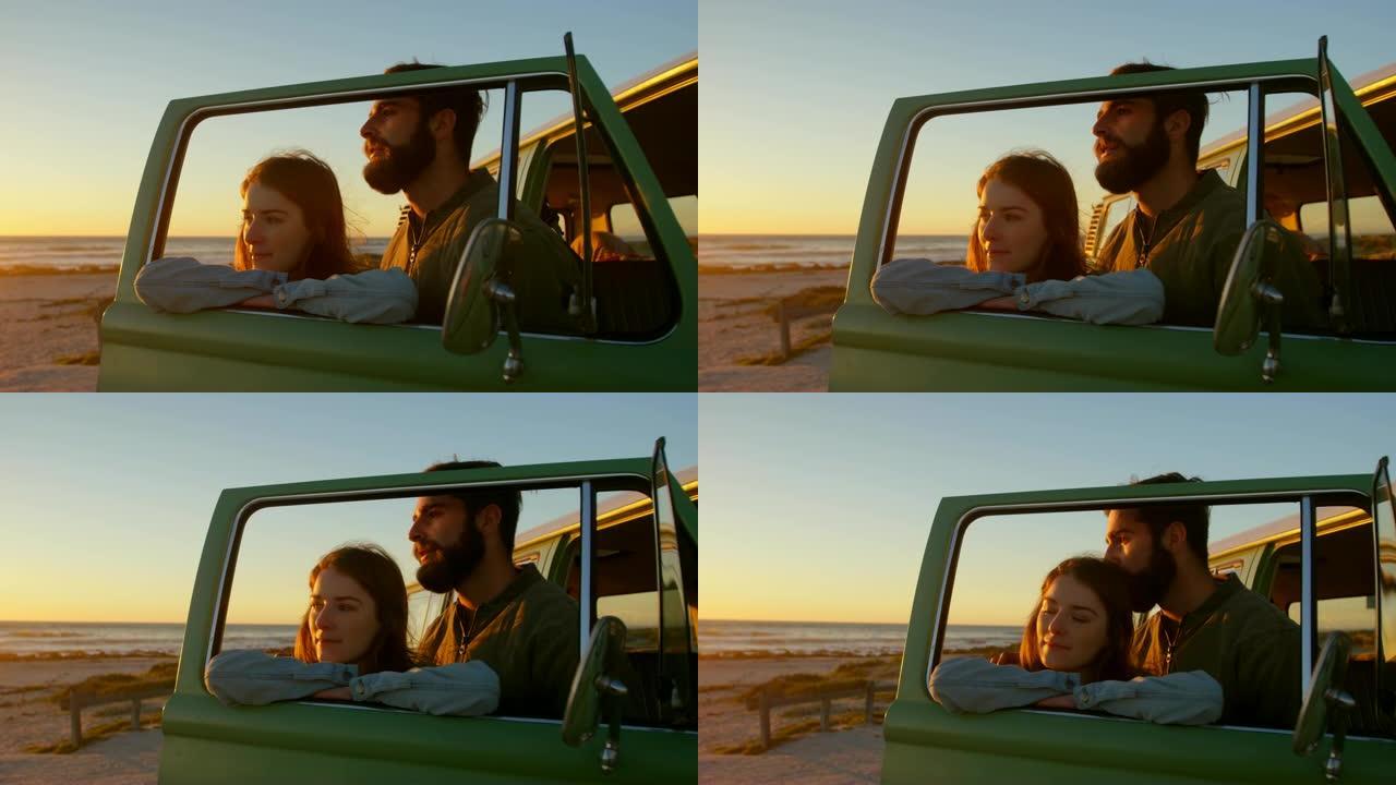 在4k海滩上，一对年轻夫妇站在车窗边