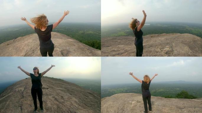 WS肖像无忧无虑的女人，双臂伸出山顶，俯瞰着风景，斯里兰卡