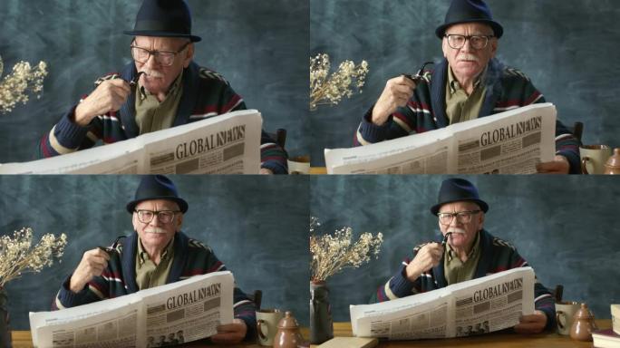 富有魅力的老人吸烟和阅读报纸