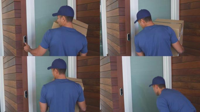 男性快递员将包裹留在房屋前门外，观察封锁中的社交距离