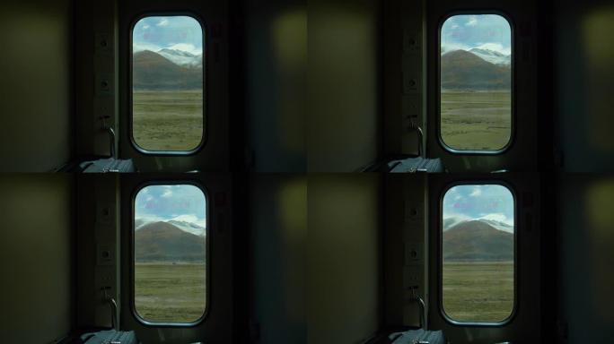 特写: 通过一扇小窗户可以欣赏到西藏风景的壮丽景色。