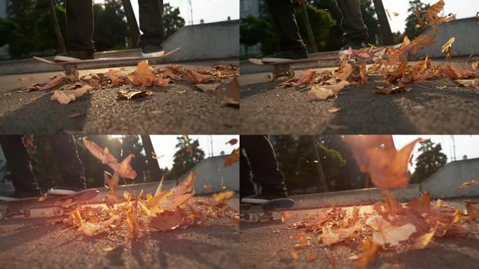 慢动作: 溜冰者在着地后用木板散射树叶。