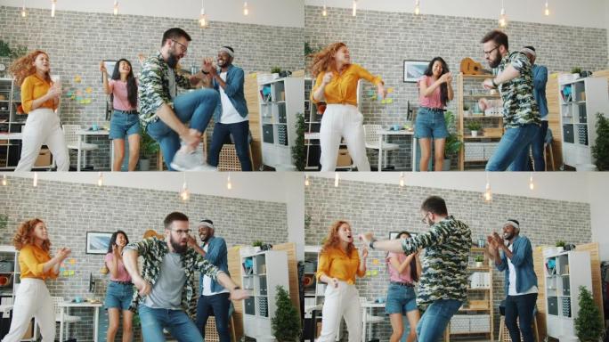 大胡子的家伙在办公室跳舞，而同事拍手一起玩乐