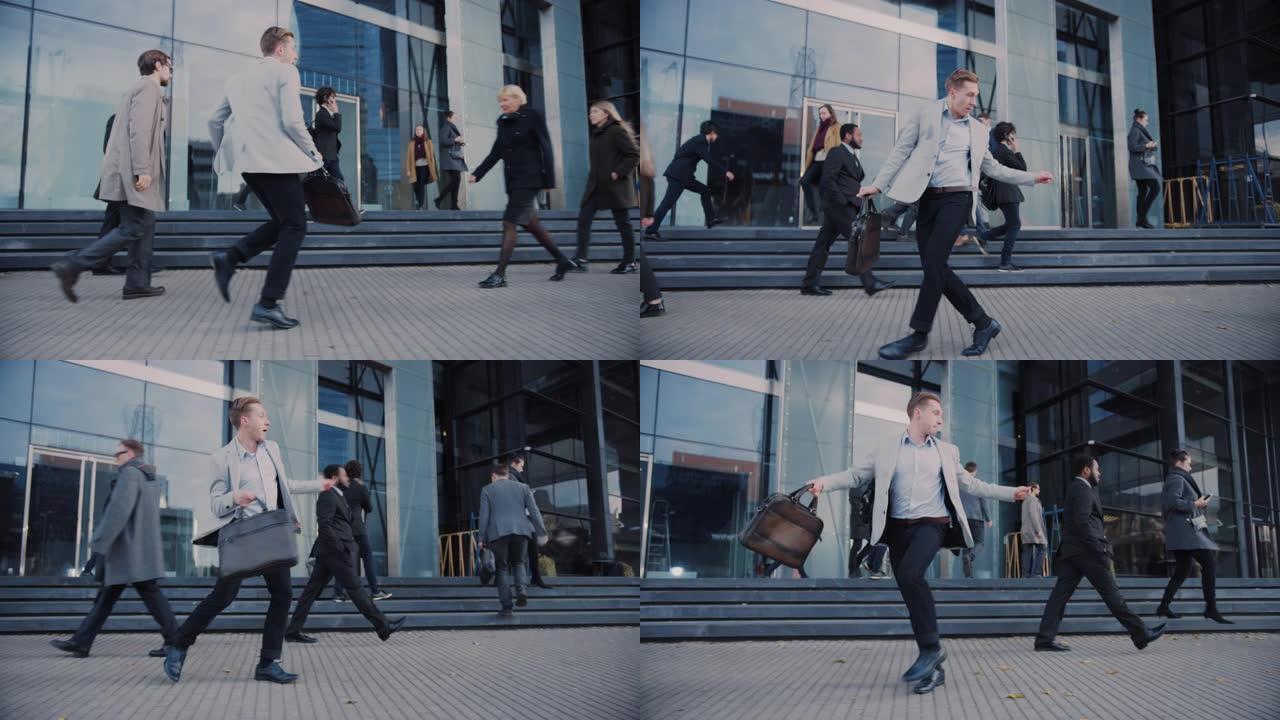 穿着灰色西装外套的开朗年轻商人正在城市街道上积极跳舞。办公室经理穿过繁忙的办公室人群上下班。他拿着一