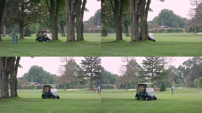 高尔夫球手在球场上驾驶高尔夫球车