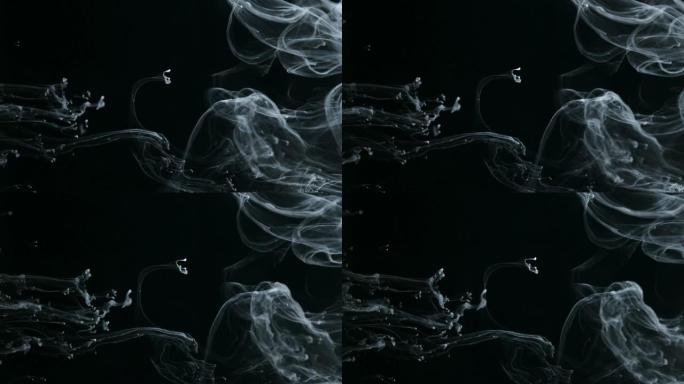 概念艺术白色油漆在水中像慢动作中的烟雾