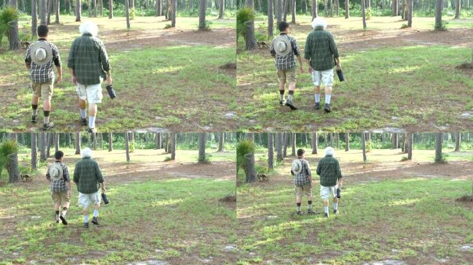 西班牙裔男孩和祖父在公园远足