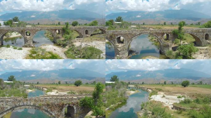 空中: 乡村景观中的空奥斯曼桥穿过干涸的河流。