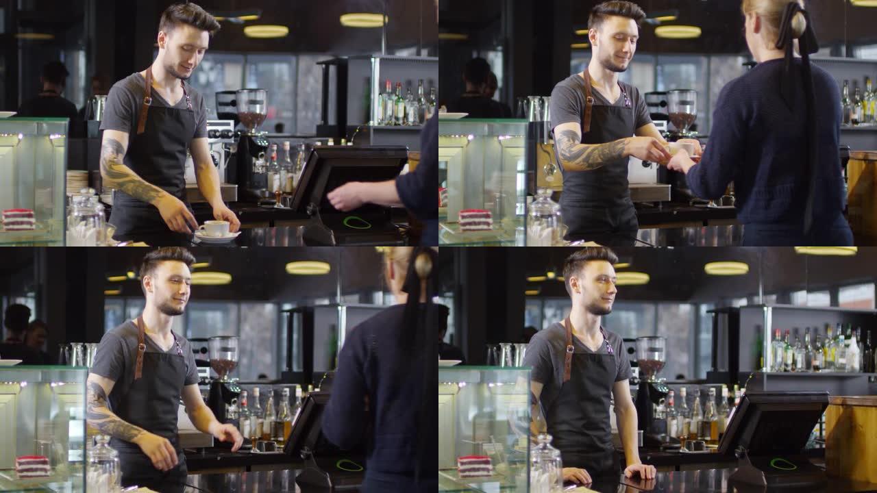 年轻的白人男性咖啡师在柜台后面为顾客服务