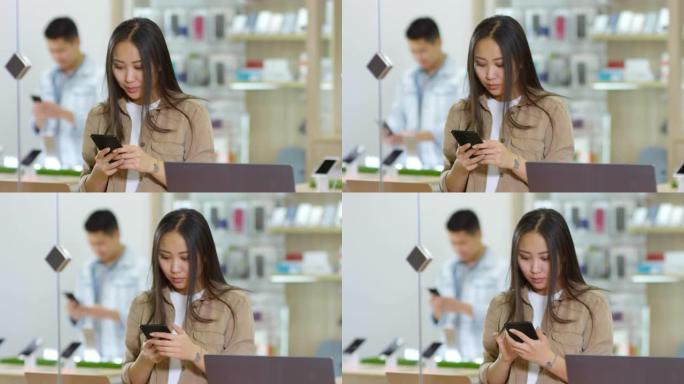 亚洲客户在商店使用智能手机