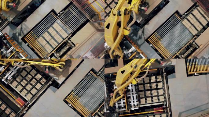 大机器在工厂的传送带上移动黄砖。
