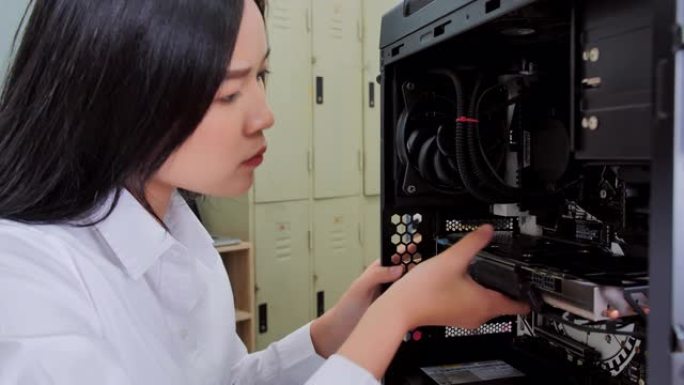 IT女顾问更换硬盘。电脑插件。教育，技术，科学和人的概念。教育主题。行业4.0，STEM中的女性