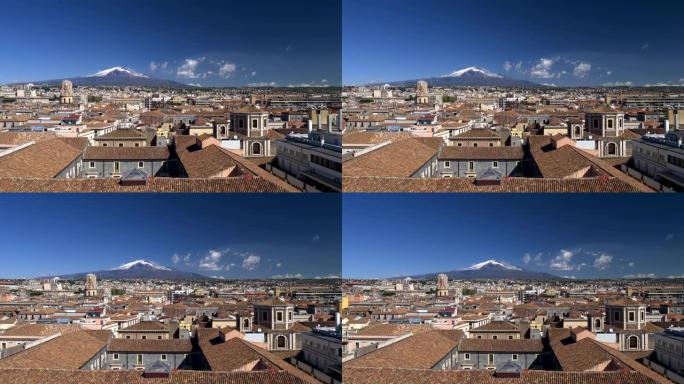 埃特纳火山在意大利西西里岛卡塔尼亚的屋顶上升起。平移镜头。4K, UHD