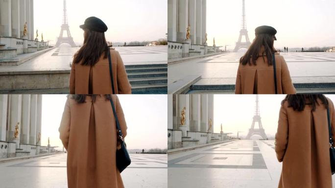 后景优雅快乐美丽的旅游女人沿着巴黎埃菲尔铁塔附近的特罗卡德罗广场散步。