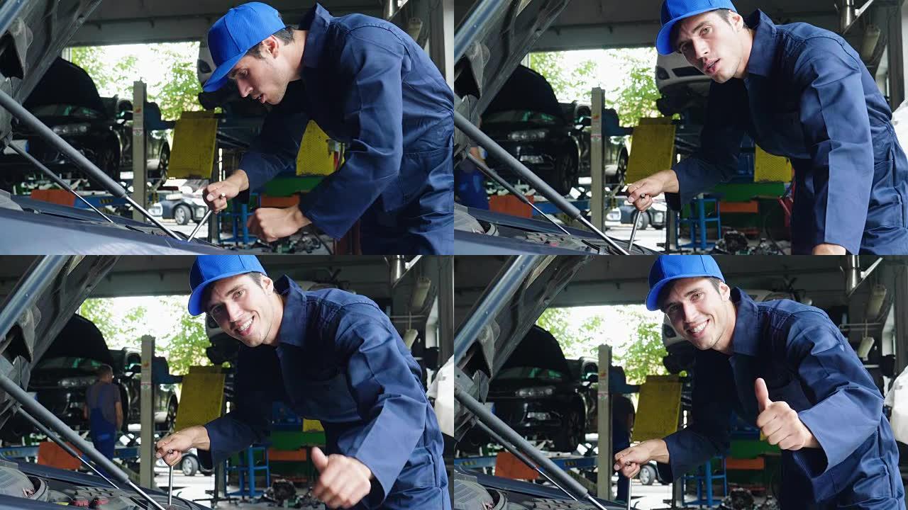 在车间里，一名机械师在检查并完成机器后，竖起大拇指并微笑着，因为汽车已经成功维修。