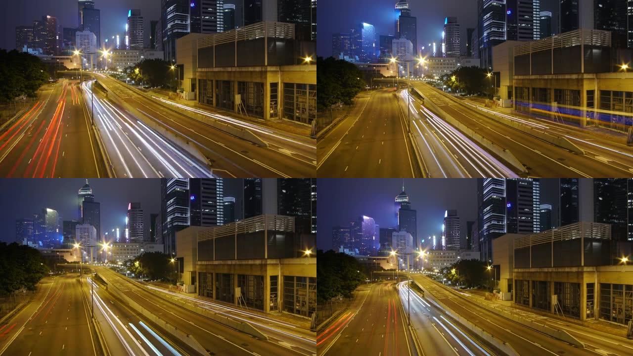 (向上倾斜) 夜间交通延时和香港摩天大楼景观。