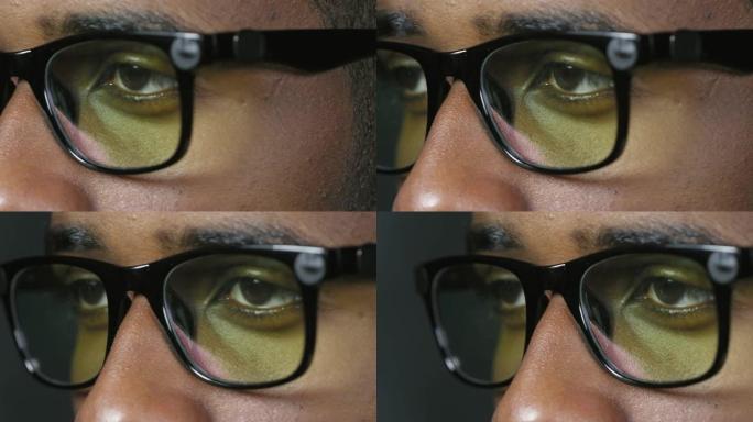 黑人在计算机上阅读的眼睛
