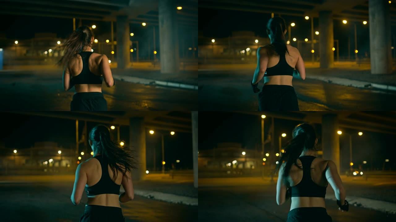 穿着黑色运动上衣和短裤的美丽健身女孩正在街上慢跑。她正在夜间的城市环境中进行锻炼，背景是汽车。