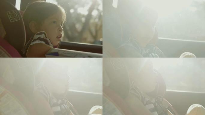 在儿童汽车安全方面。小女孩坐在一个特殊的汽车座椅上