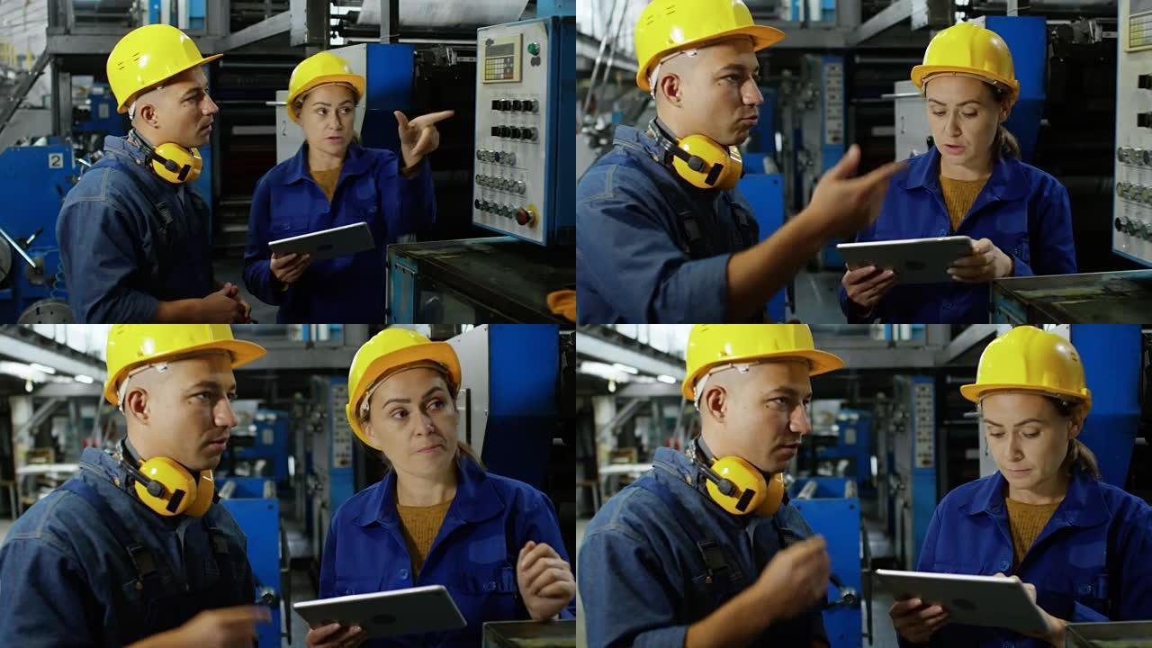 女工程师与工厂工人交谈